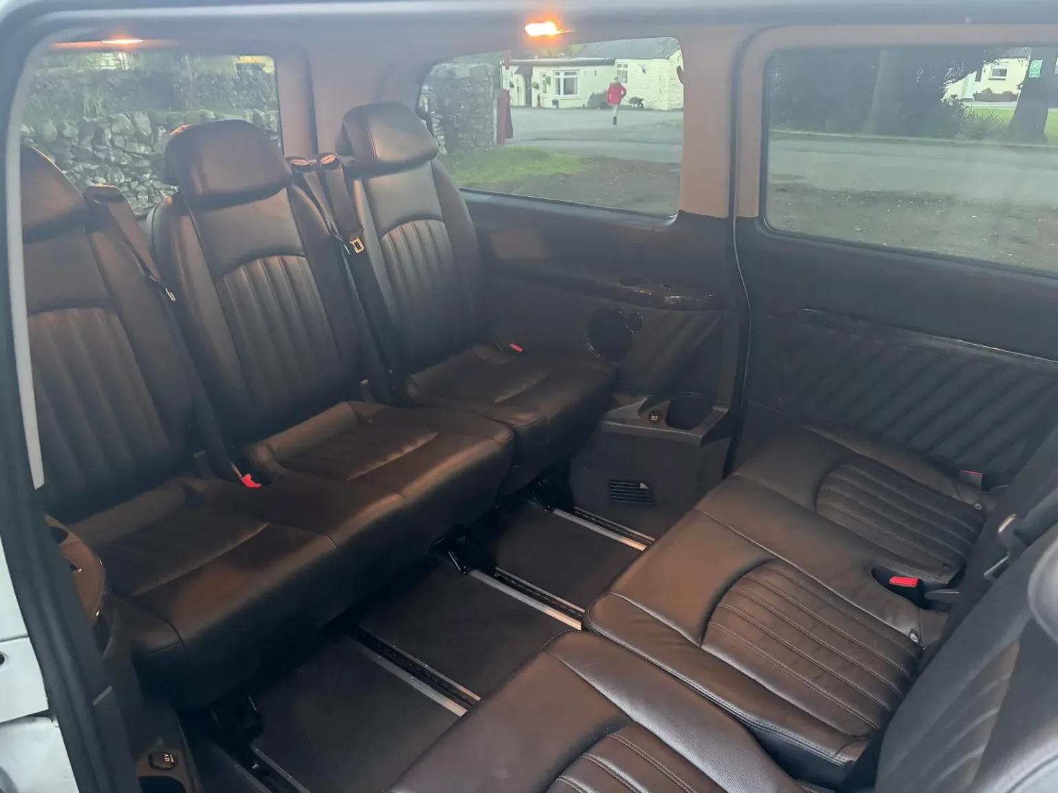 Rows of black leather seats inside the Mercedes 9-seater