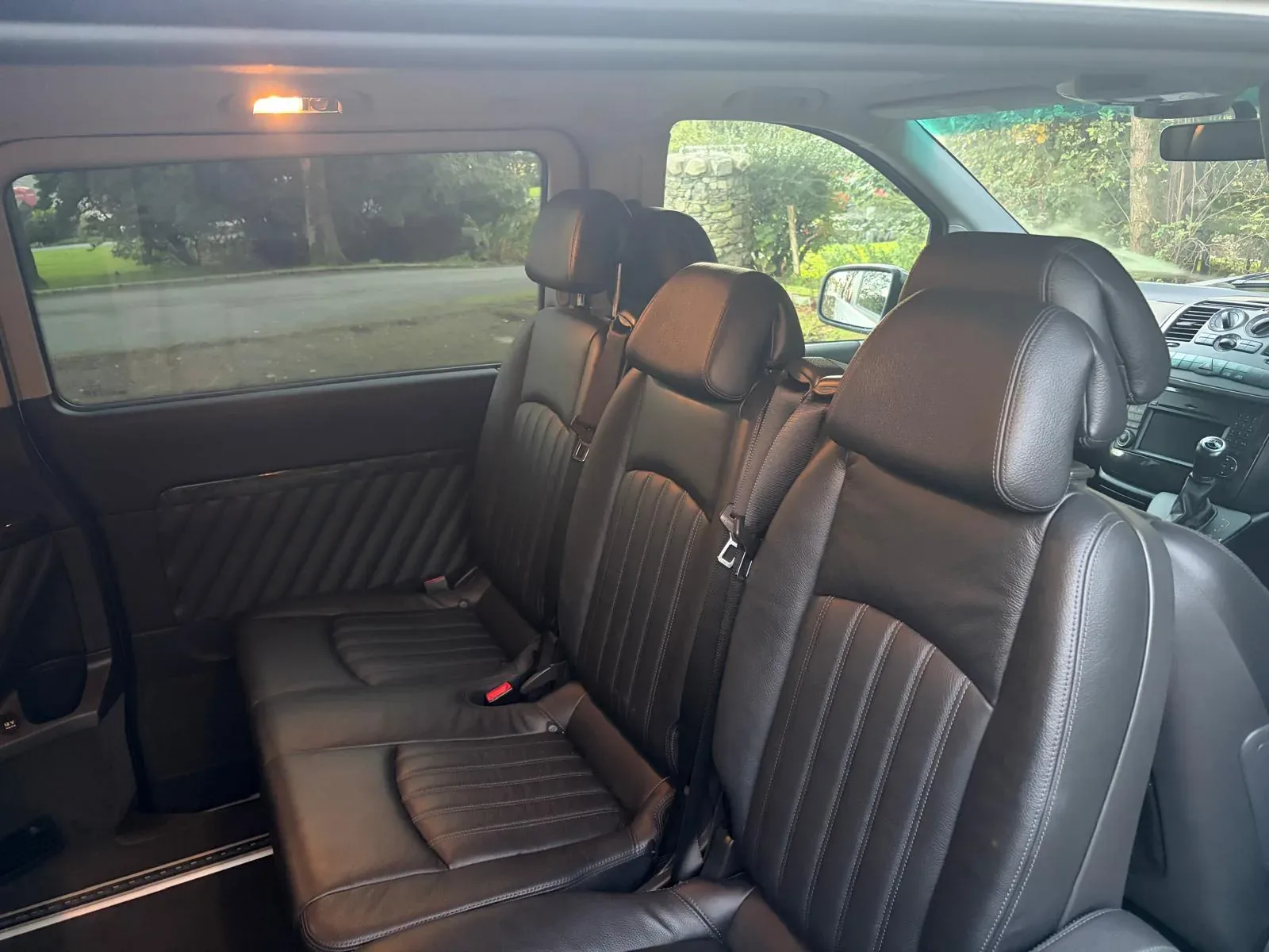 Black leather seats inside the Mercedes 9-seater