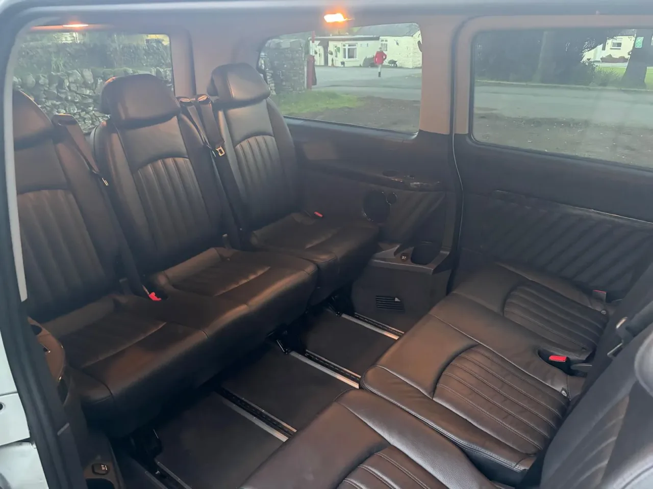 Rows of black leather seats inside the Mercedes 9-seater